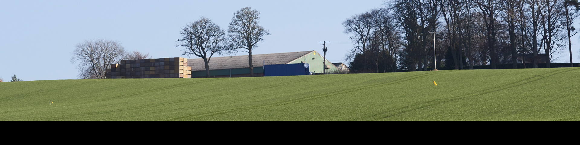 Farm field with farm building