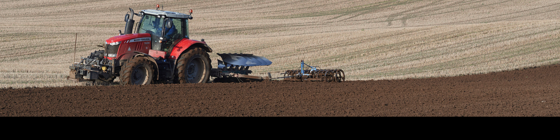 Tractor plowing a field