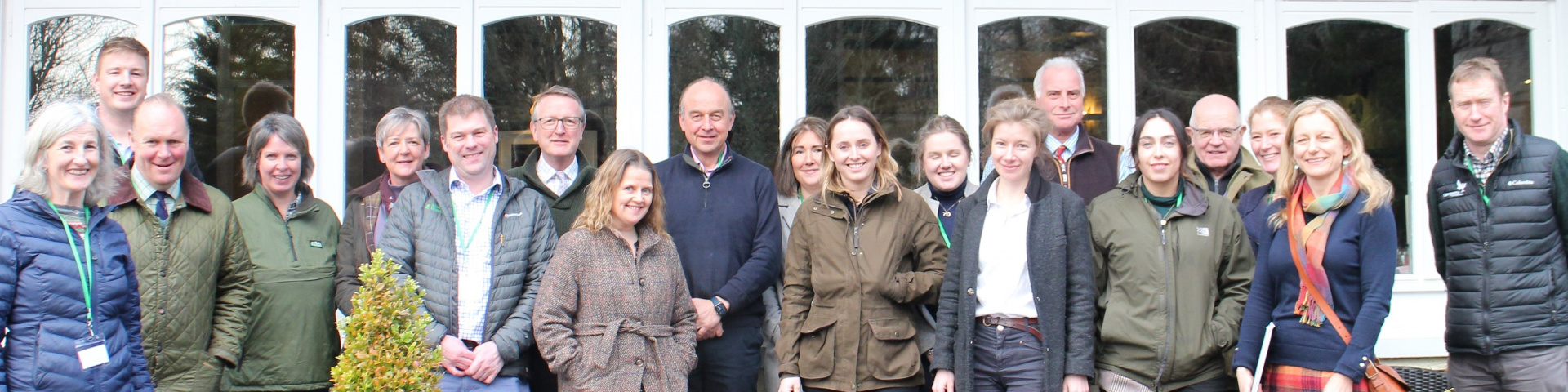 Scottish Land Commission staff, Scottish Land & Estates staff, and members of Scottish Land & Estates member organisations outdoors in the Cairngorms at a Leadership in Good Practice event.