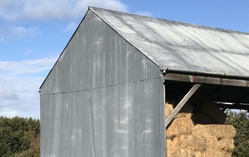 Metal barn with hay