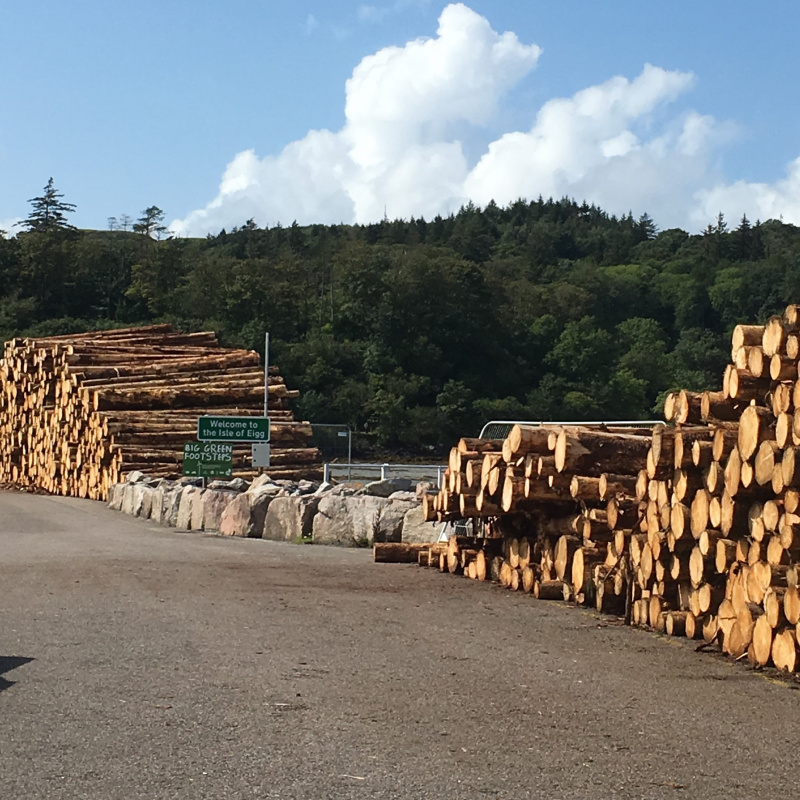 Timber stacked at Eigg causeway ready for transport away from the island. Learn more in our 'Timber Eiggxport' case study.