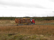 A timber lorry traveling across Eskdalemuir.