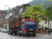 A timber lorry driving through Callander, Perthshire.