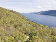 Aerial view of tree-covered hillside and loch on Bunloit Estate. Courtesy Highlands Rewilding.