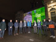Students from the winning team from Kemnay Academy pose in front of their film projected onto the Scottish National Gallery of Modern Art building with teacher Sandra Buchan, Commission Chair Andrew Thin, Calum Maclean, and Commissioner Lorne Macleod. Credit: Adam Kenrick.